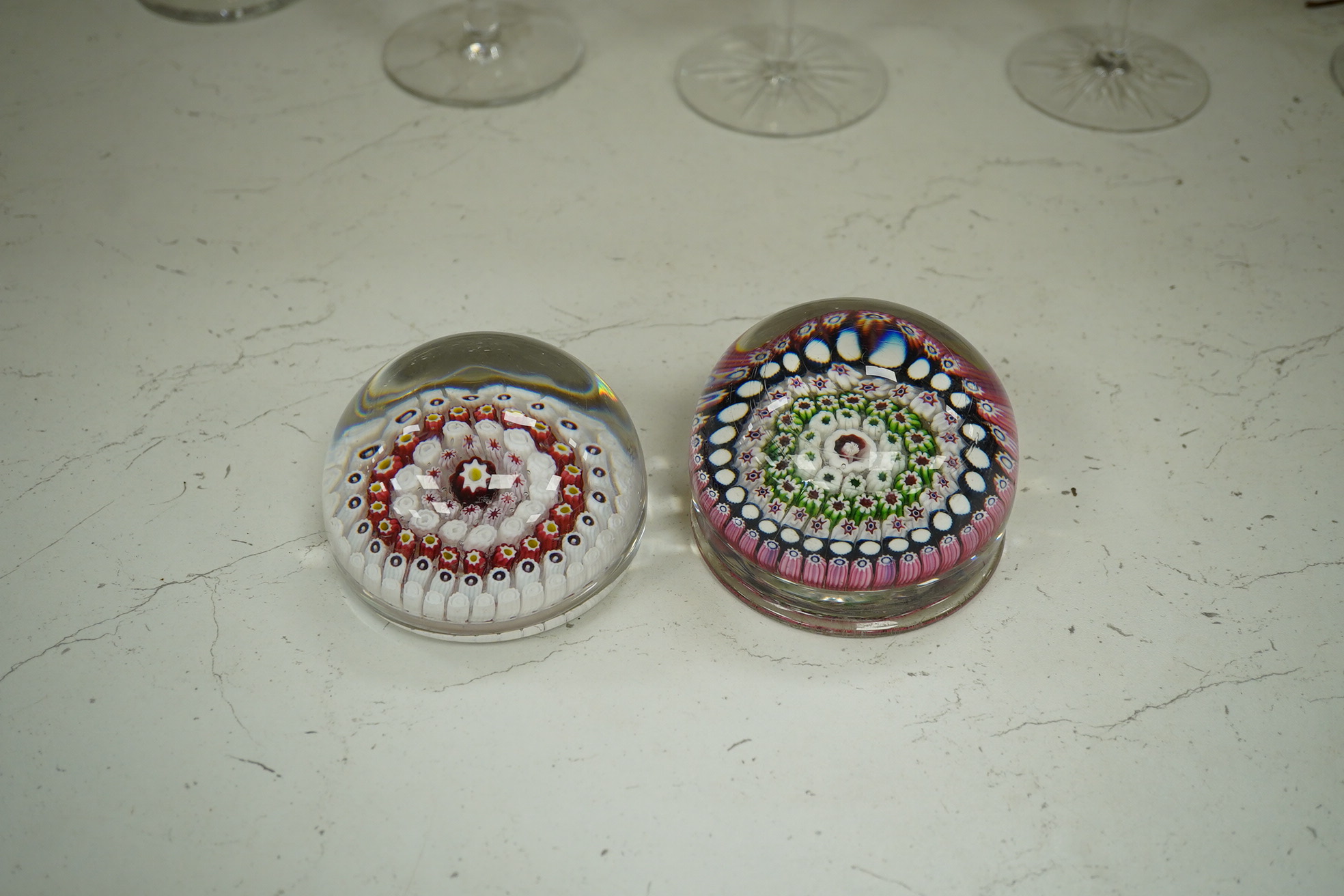 Two Victorian English millefiori glass paperweights, 7cm tall. Condition - fair to good